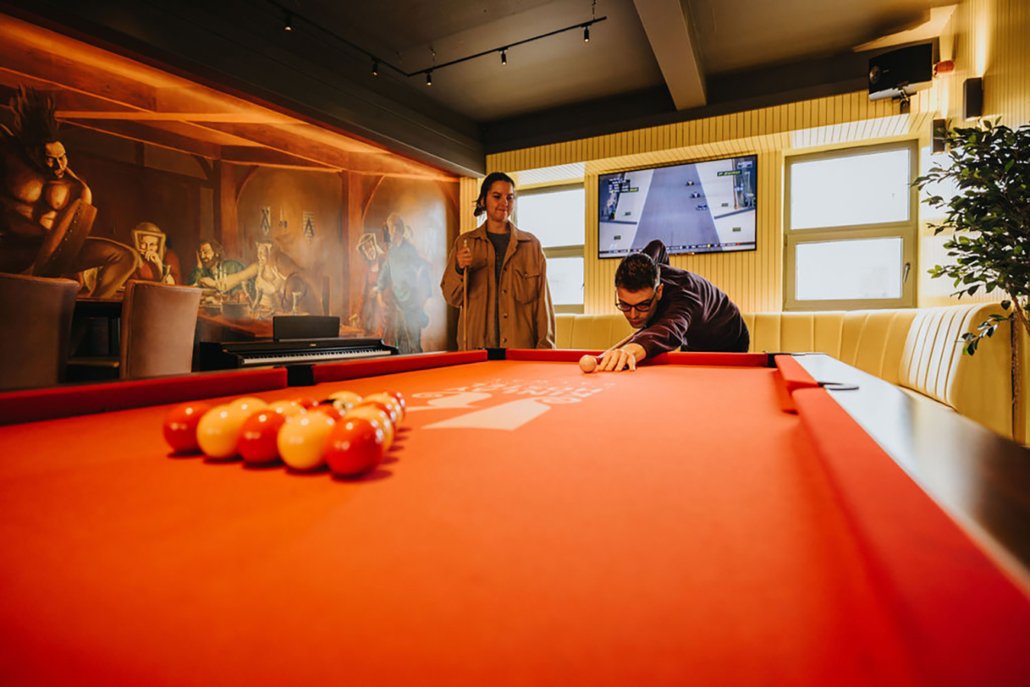 Students Playing Pool - Hostel's Games Room