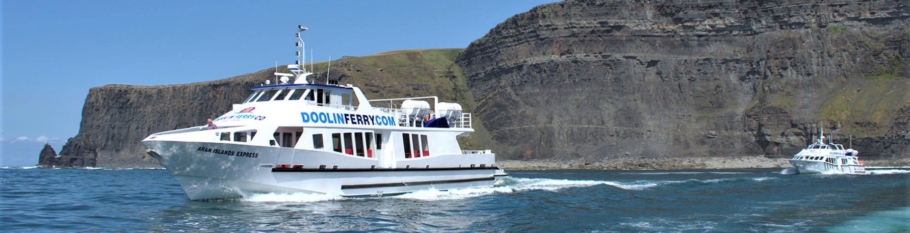 Two Ferry Boats of the Doolin Ferry Company on the Atlantic Coast With Cliffs of Moher in the Background