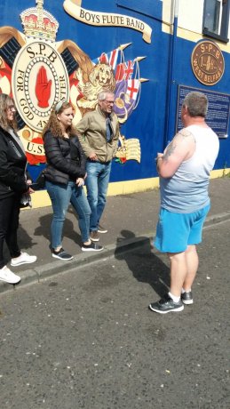 Coiste Tour with Mural 1980 Unionist in the Background