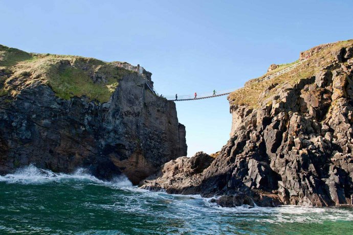 People Crossing Rope Bridge View From The Boat