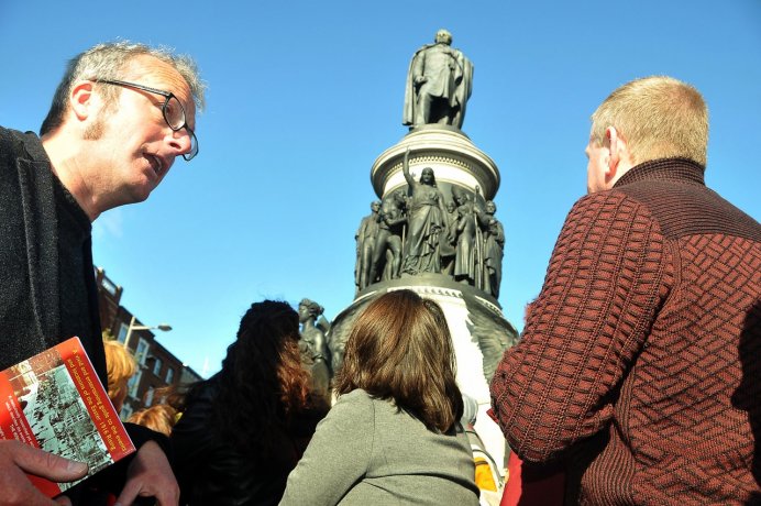 Group tour looking at OConnel Monument