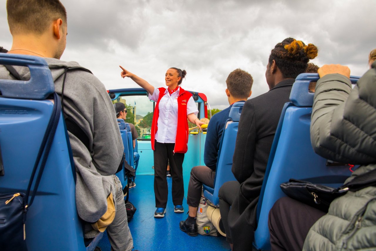 City Sightseeing Guide on the top deck of the bus for groups