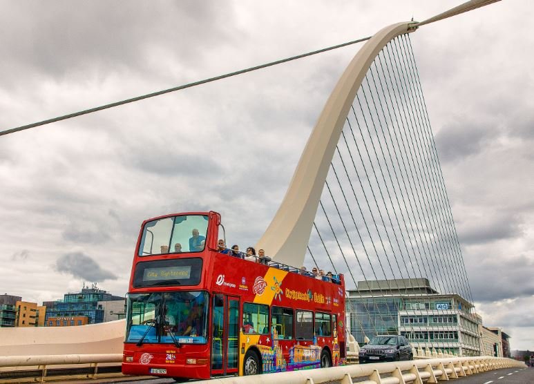 Tourists on an open-top City Sightseeing Bus in Dublin