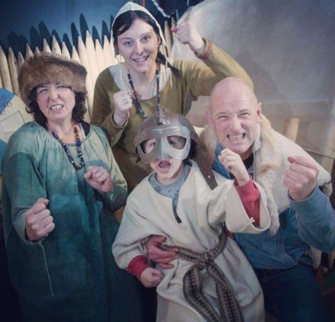 Family of four dress up in Viking costumes