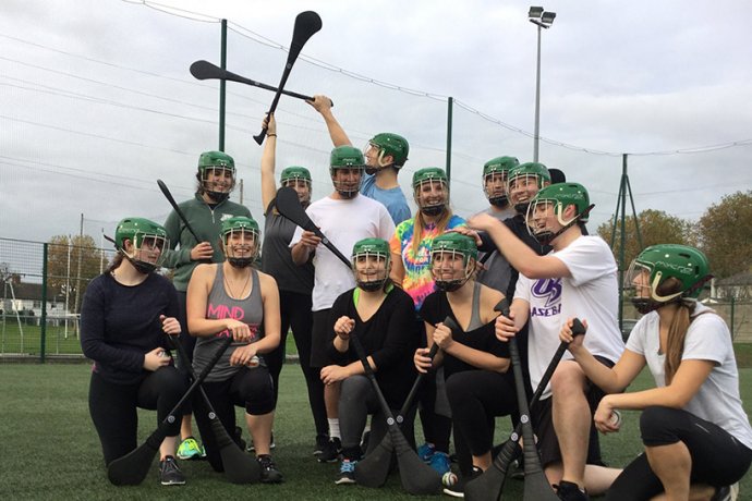 Group With Hurling Sticks Celebrating Gaelic Games Victory in Dublin