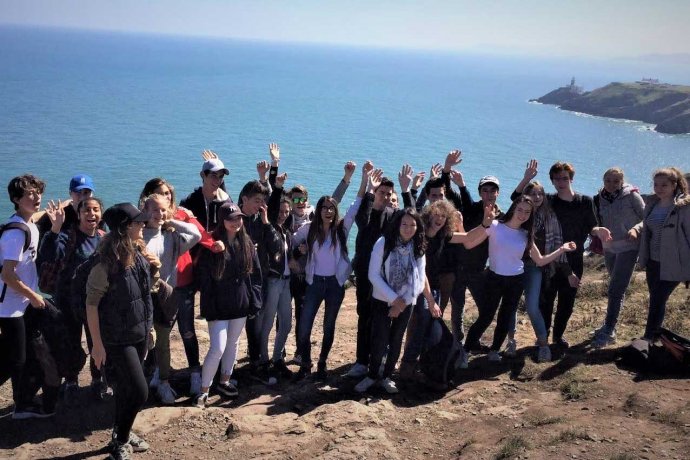 Group of Tourist on a Walking Trip on the Clifftop 