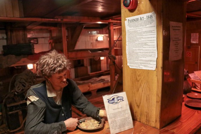 Immigrant eating on a ship - Tour groups