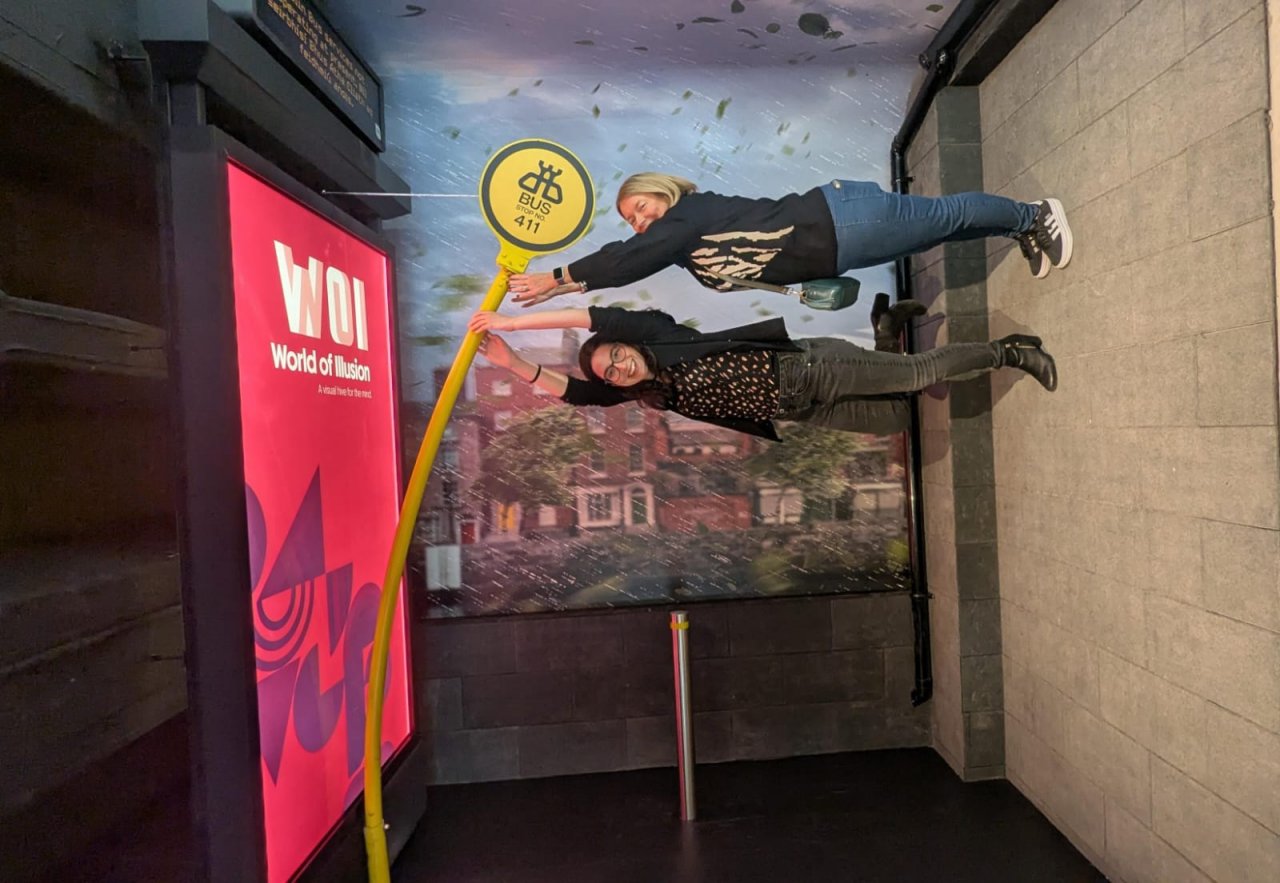 Dublin Bus Stop Sign Bended and used for orientation effect. Visitors pretend to be blown away 