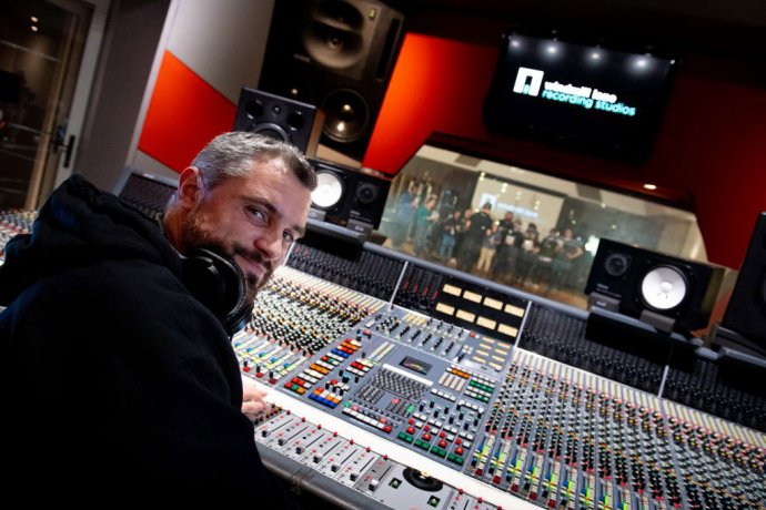 Man at the Music Recording Studio Mixing Console 