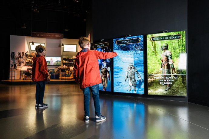 Interactive Exposition in the Game of Thrones Studio - Two Kids Playing on large Display Screens