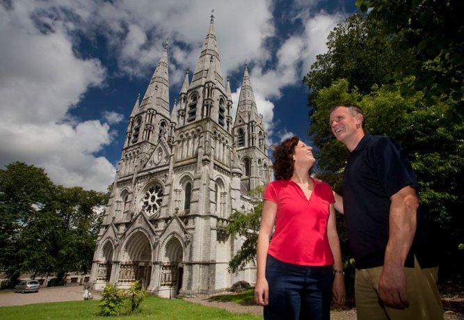 Smiling couple outside St Fin Barre's Cathedral