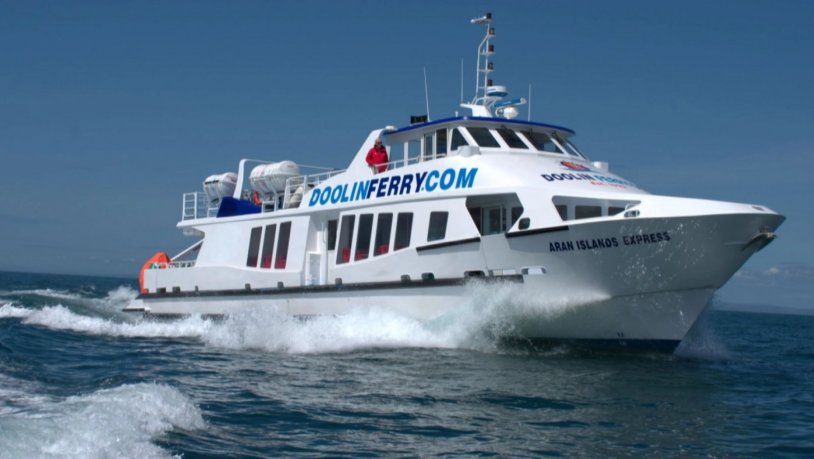 Doolin Express Ferry at sea at full speed with a large writing on a side of the cabin DoolinFerry.com