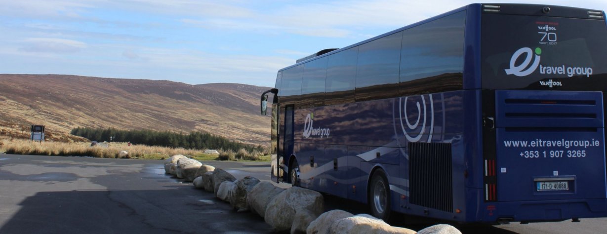 Blue 55 Seater Coach Awaiting Group of Students Parked on a Remote Hill Car Park in Burren Co Clair Ireland