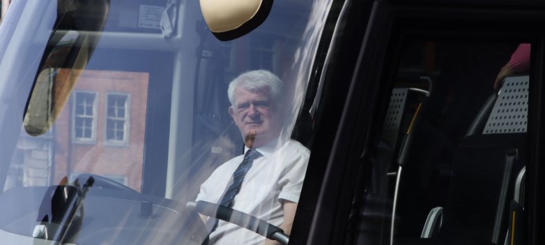 Driver behind the wheel in the modern bus in ireland