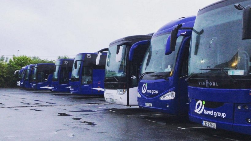 Fronts from angle of several buses parked on a car park ready for groups 