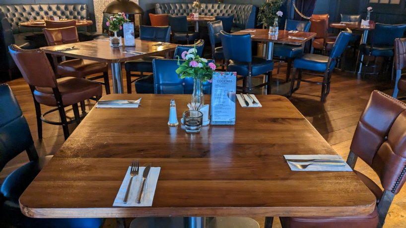 brown tables and blue chairs ready for school groups, student trips and sport teams