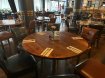 restaurant dinning area with round brown tables and brown chairs. Affordable 2 or 3 course meals for groups in Dublin