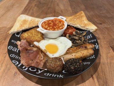 Plate with Full inglish Breakfast Served on a Black Plate