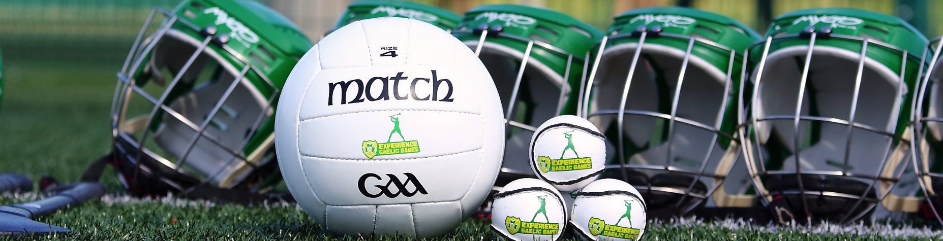 Helmets, Balls and Bats on an Astroturf Training Ground Ahead of the Gaelic Football Game