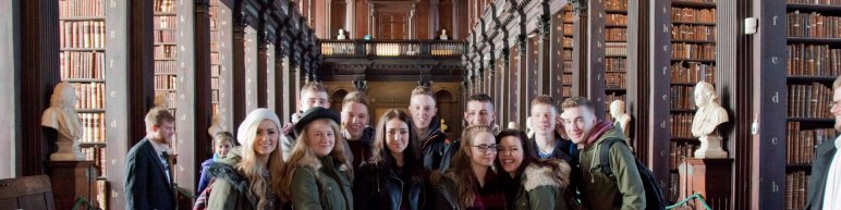 Group of students on a tour in Dublin at Trinity College Library