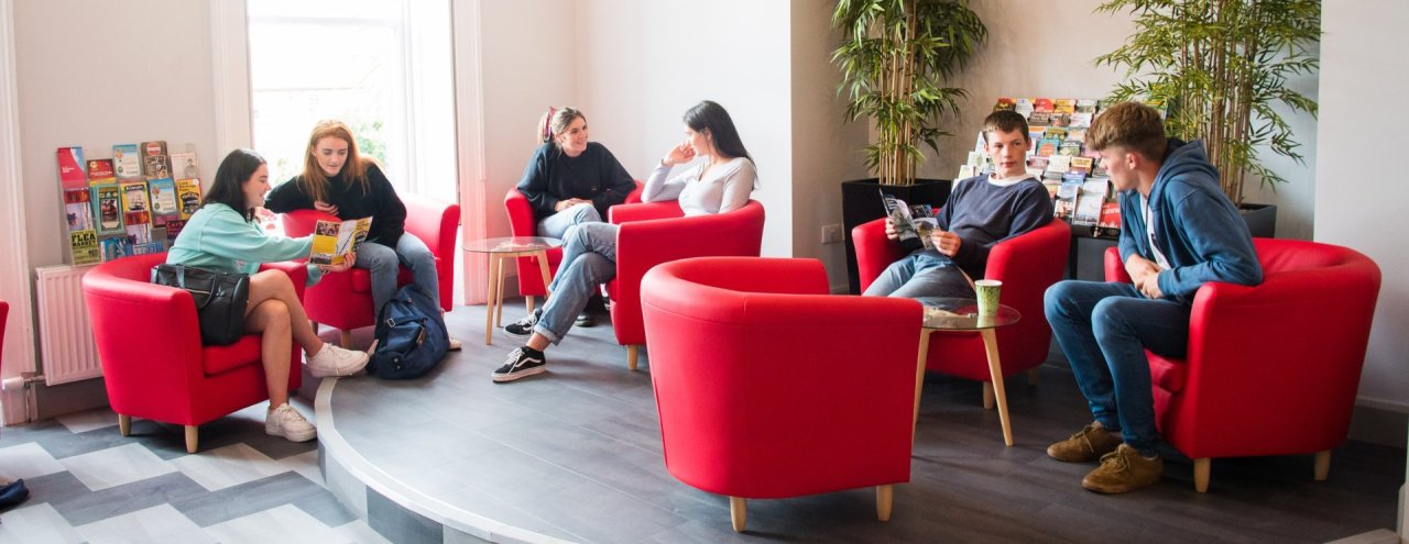 Cork Hostel Reception Group of Students sitting around 