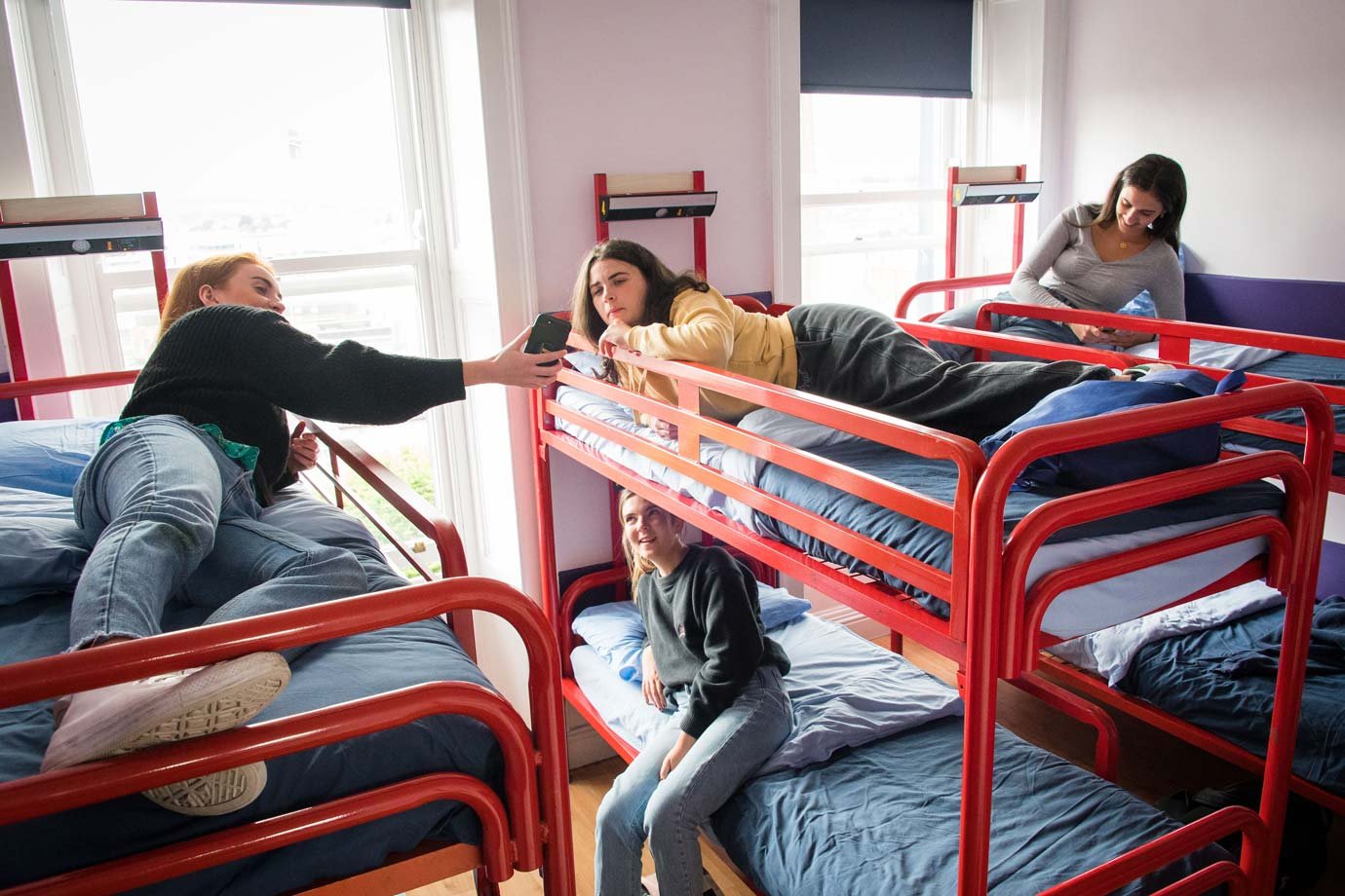 Break After the City Centre Exploration - Students in Red Bunk Beds - Hostel
