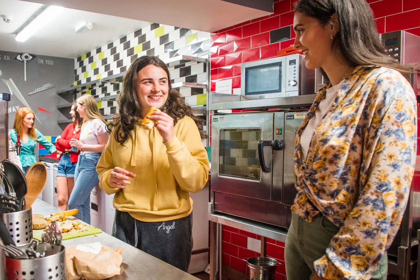 Students Having a Chat - Self Catering Kitchen in Hostel