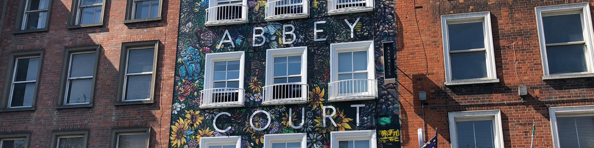 Flowery Mural-Covered Abbey Court Hostel Front