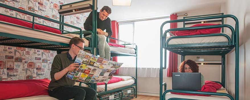 6-Bed Room with Bunk Beds in Abrahams Hostel in Dublin Tourists Chatting on Bunk Beds in Six Bed Room in Hostel