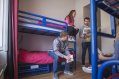Tourists in Double Twin Room Hostel Accommodation Bunk Beds