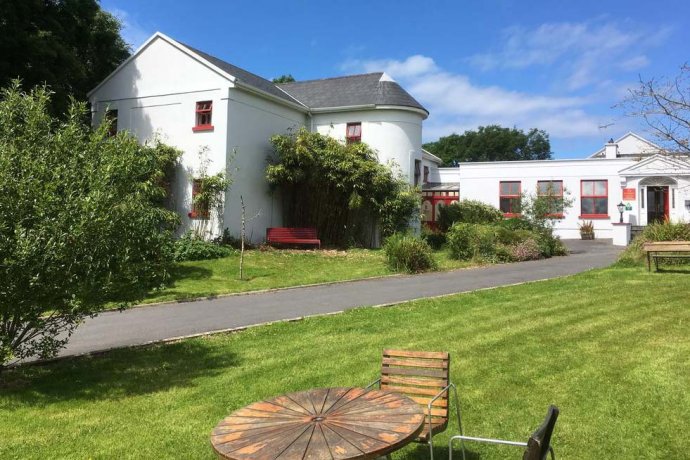 Hostel Buildings from Outside - Hostel Grounds with Picnic Table