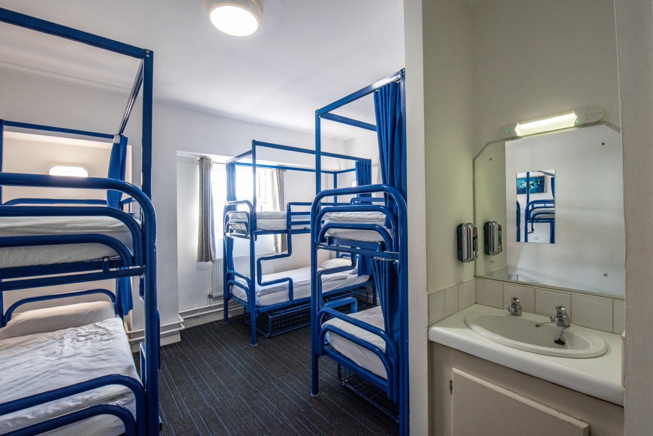 3 Bunk Beds in a Student Hostel Room with Facilities