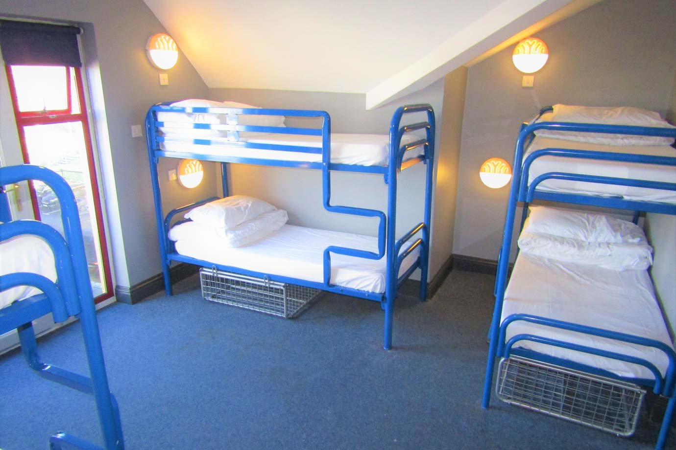 Three Bunk Bads in Student Hostel Room Blue Bad Frames