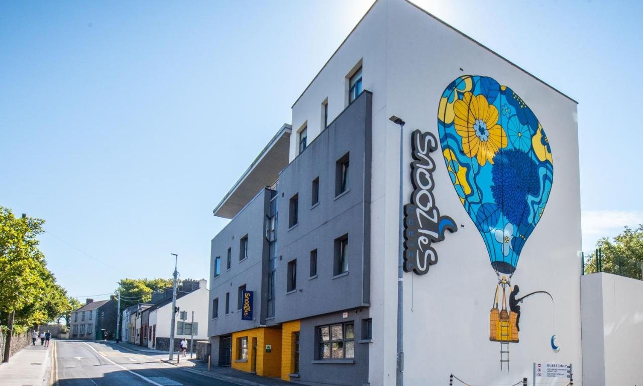 Funky New Hostel Building in Galway with Logo "Snoozles" and a large picture of the Hot Air Balloon on the Side of the Building  