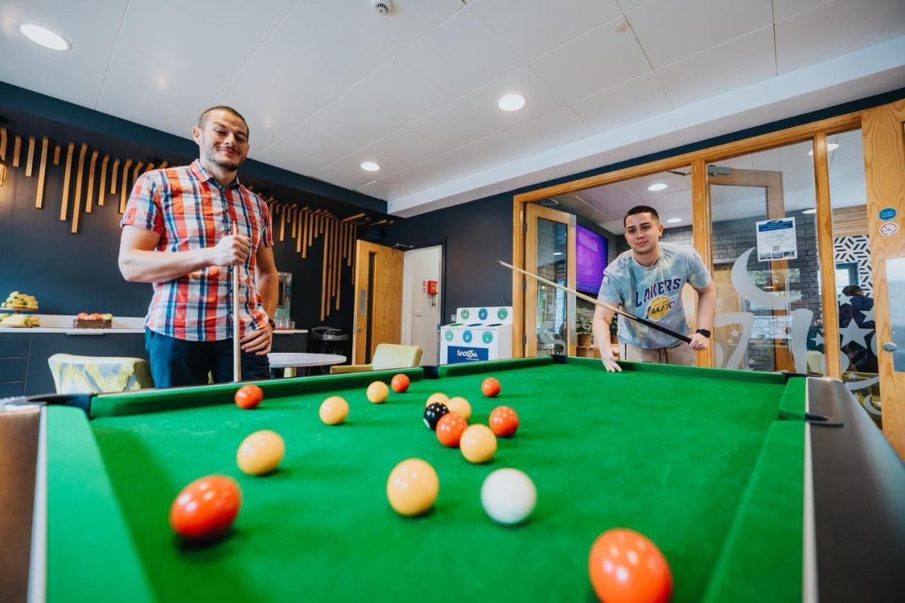 Common and Games Room in the Students Playing in a Hostel 
