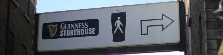 Sign of Guinness Storehouse in Ireland with an arrow towards the entrance 