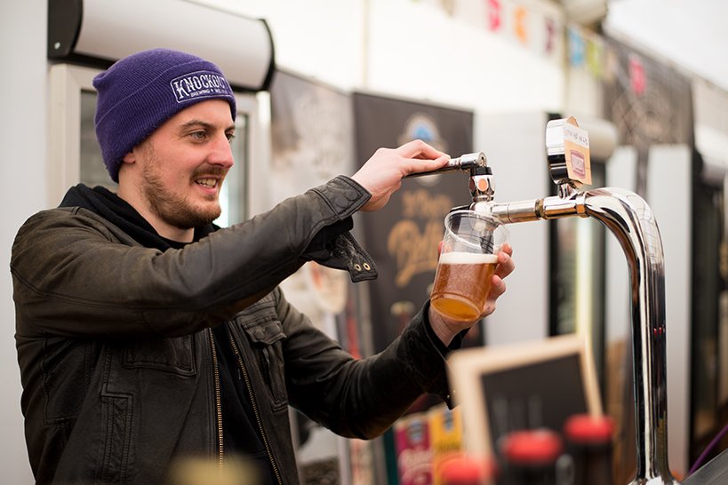 Guy Filling a Glass of Beer During the Oktoberfest Dublin