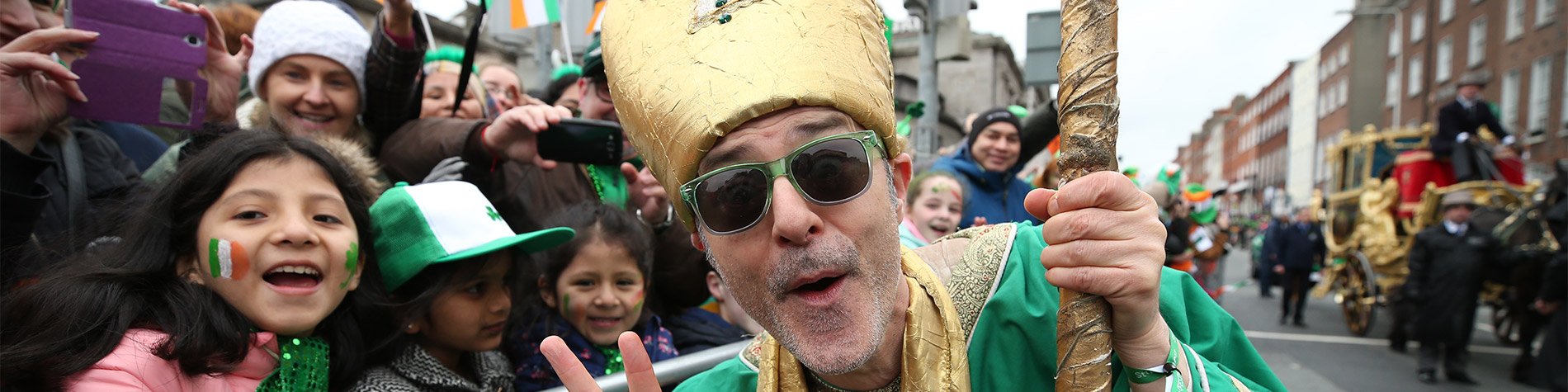 Children and adults enjoying St Patrick's Day Parade