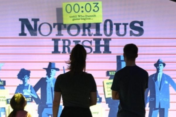 Tourists looking at one of the displays at The Irish Museum of Emigration