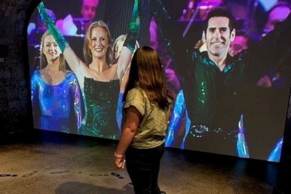 Girl looking at an audiovisual display of Riverdance at EPIC Ireland