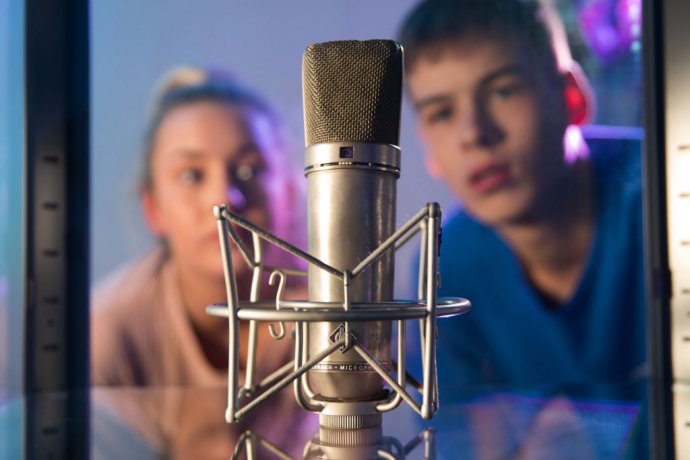 Students looking at a displayed microphone at Recording Studios in Dublin