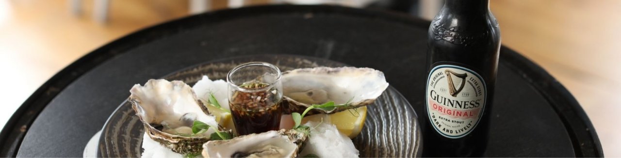 A plate of Irish Oysters and a bottle of Guinness